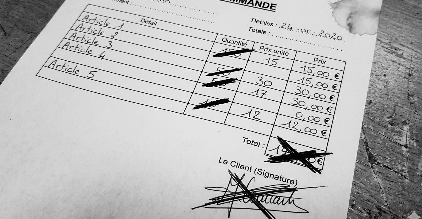 Bon de commande papier raturé à plusieurs reprises avec signature client raturée
